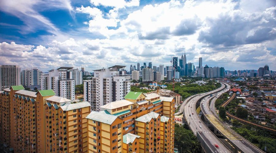 75706057 - aerial photo - clouds at kuala lumpur city.